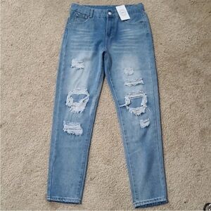 light blue heavily distressed cuffed slight skinny leg jeans
